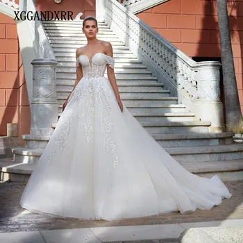 Yeni Varış Şapel Tren düğün elbisesi 2023 Sevgiliye Ayrılabilir Kollu Backless Dantel Aplike Köpüklü Uzun gelin kıyafeti Gala